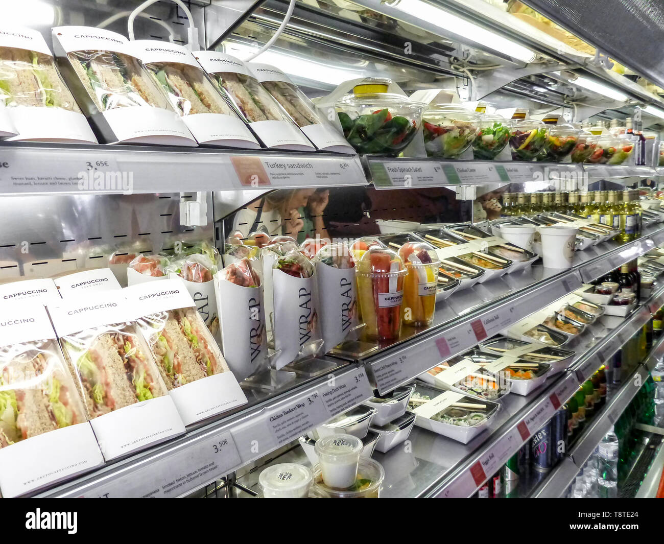 Bad habits of the human in modern times: shelf full of pre-packaged foods, ready to eat. Plastic abuse to contain ready-to-eat salads, sandwiches, fru Stock Photo