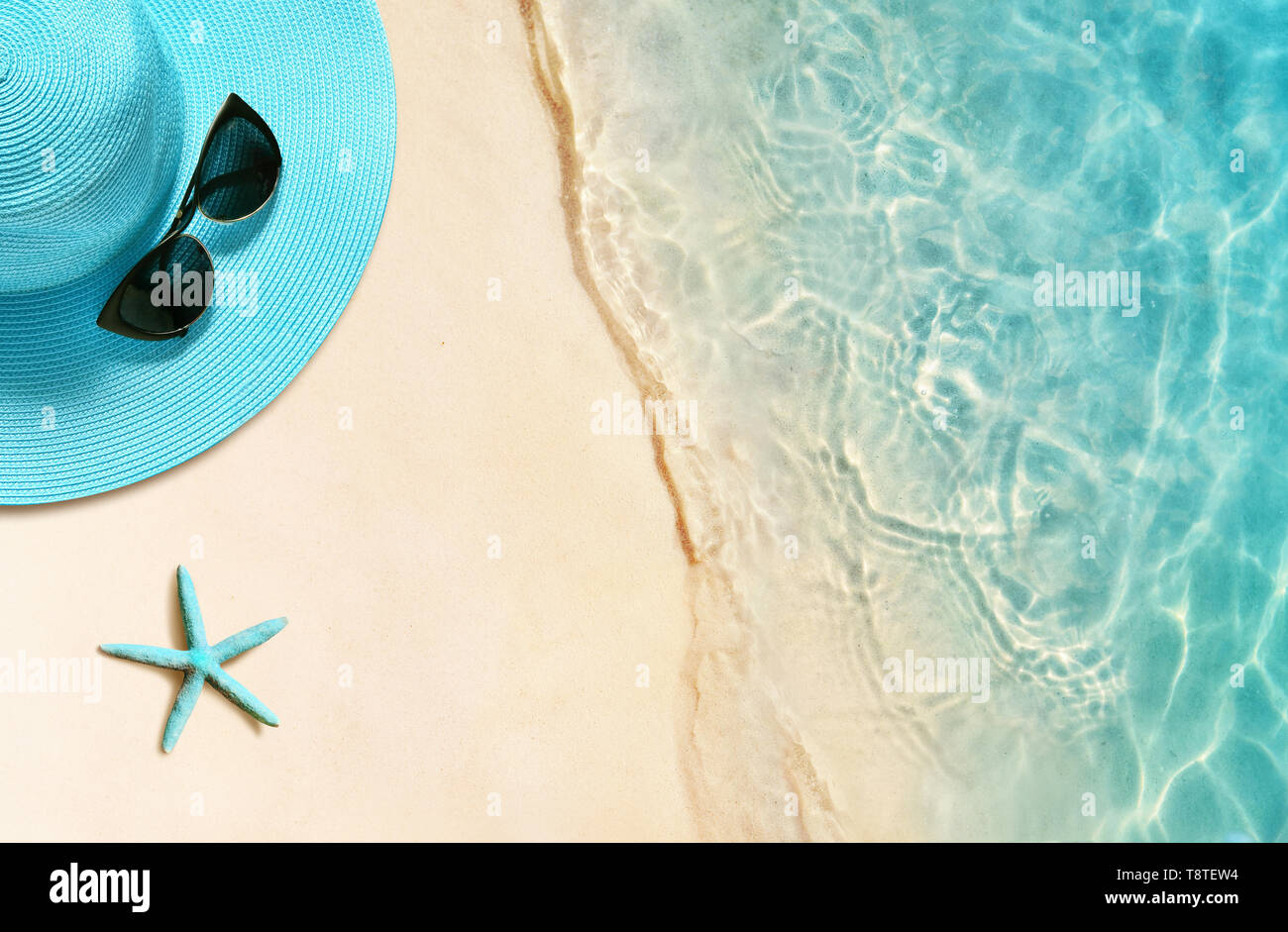 Hat and sunglasses on the sandy beach. Summer background Stock Photo ...