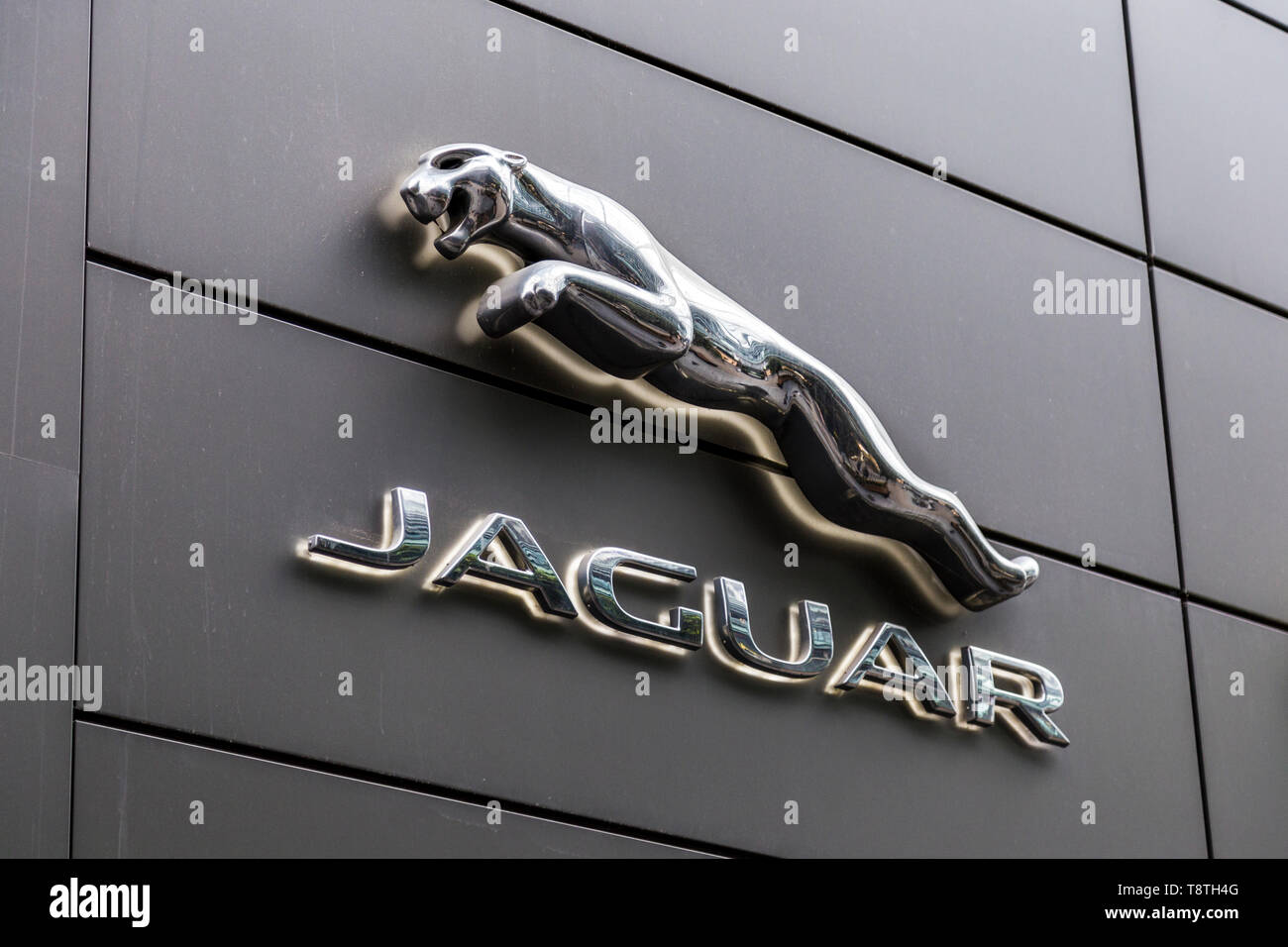 Logo of Jaguar luxury and sports car brand above the shop in Westfield Stratford, London, UK Stock Photo