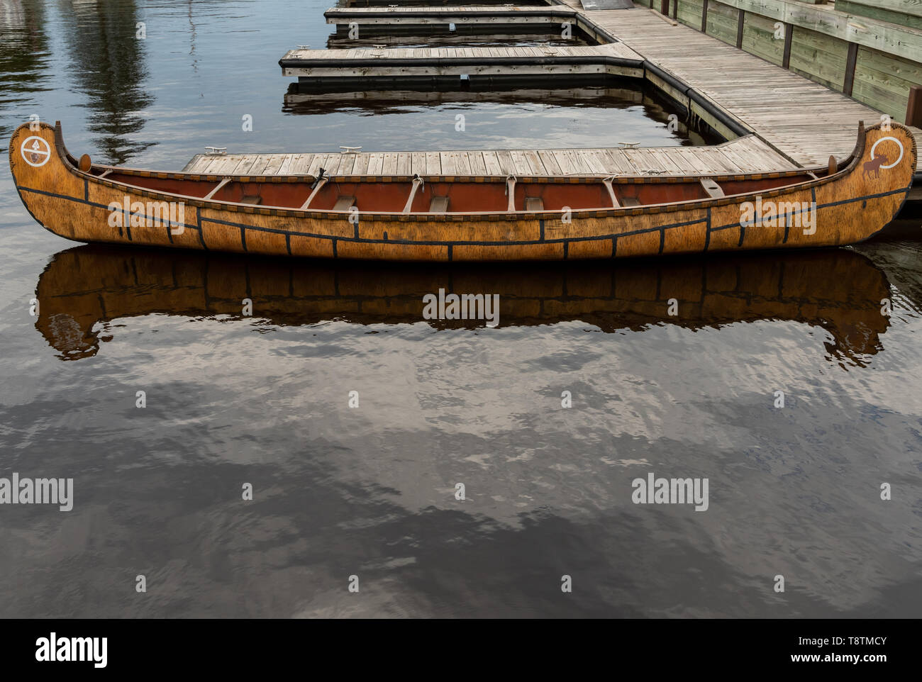 Antique Canoe at Voyageurs National Park resting on dock Stock Photo