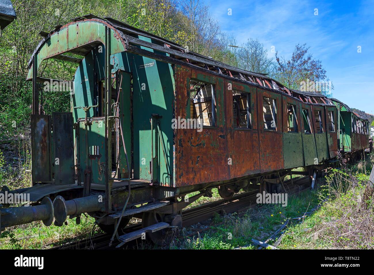 Discarded, dilapidated rusty wagon of a passenger train on a railroad siding, Upper Franconia, Bavaria, Germany Stock Photo