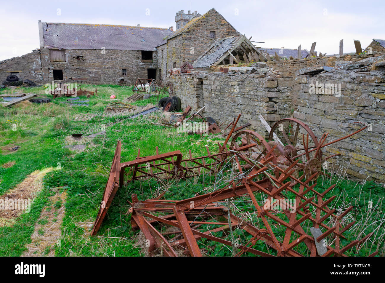 Old rusted mechanical reaper, Orkney Isles Stock Photo