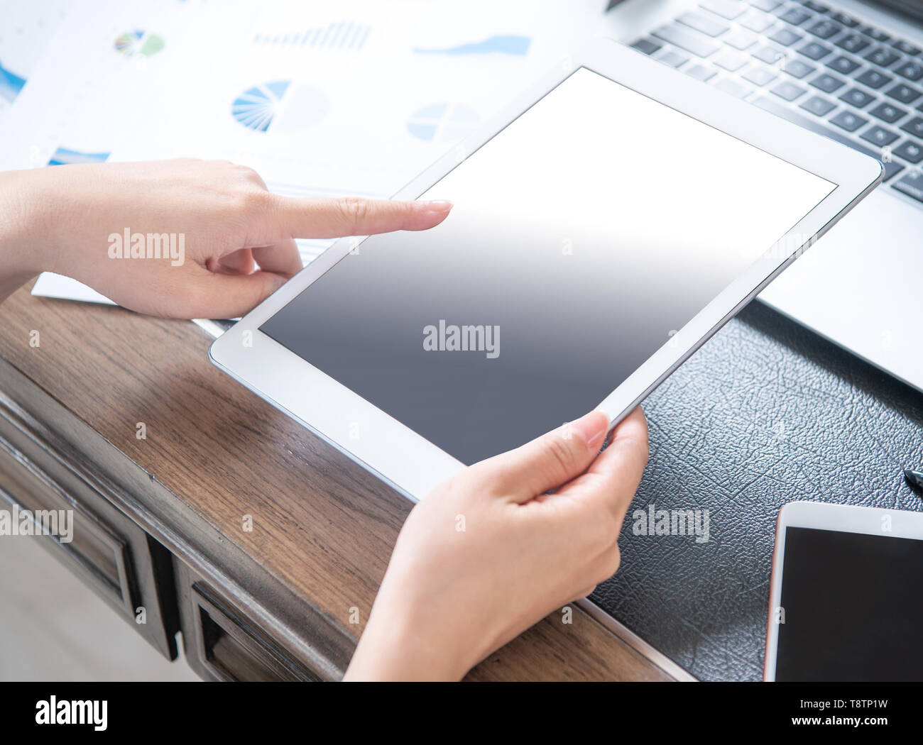 Business concept. Woman using tablet for project with digital device in office desk