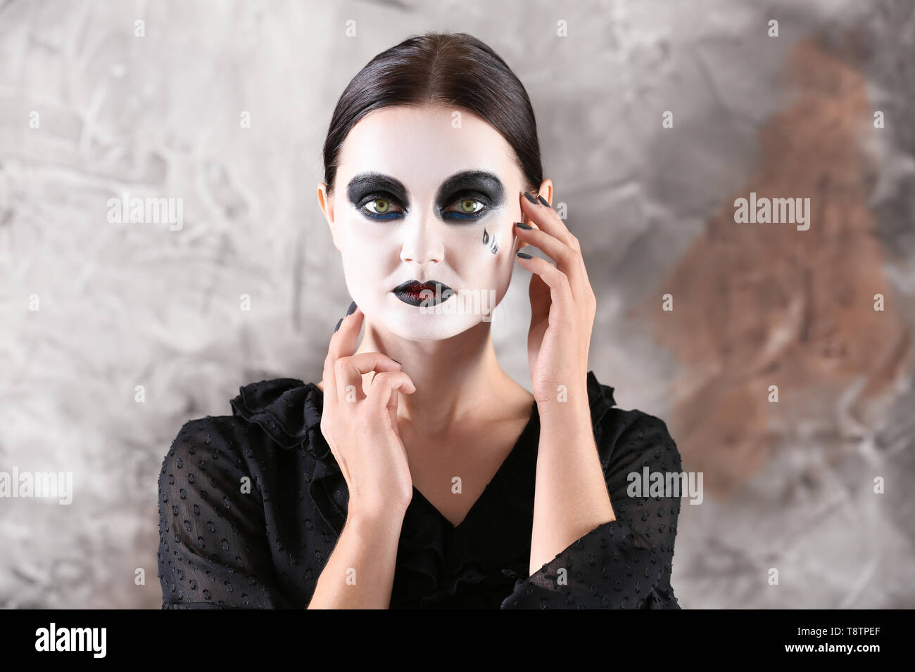 Beautiful woman with Halloween makeup on grey background Stock Photo - Alamy, image size:1300x956