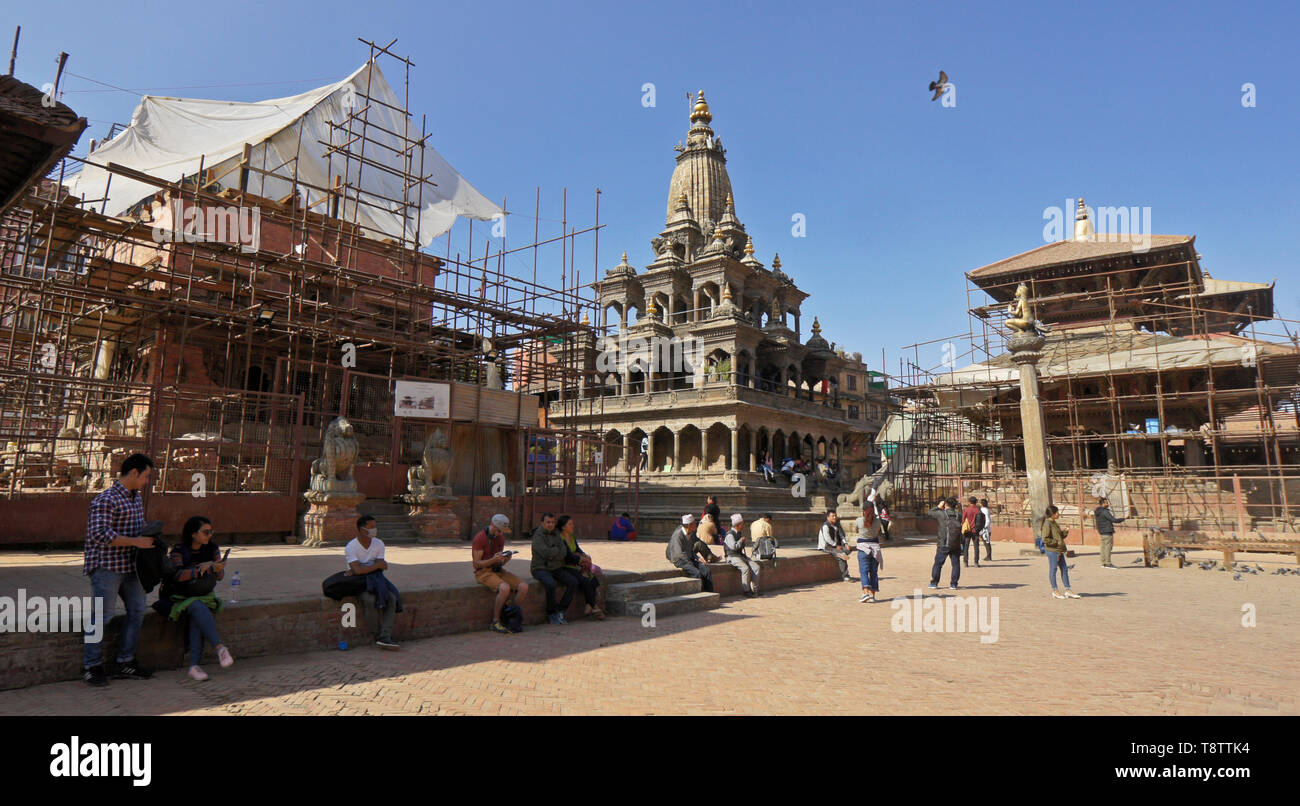 Krishna Mandir (center) and restoration of Hari Shankar Mandir and Bishwanath Mandir, badly damaged in the 2015 earthquake, Durbar Square, Patan, Kath Stock Photo