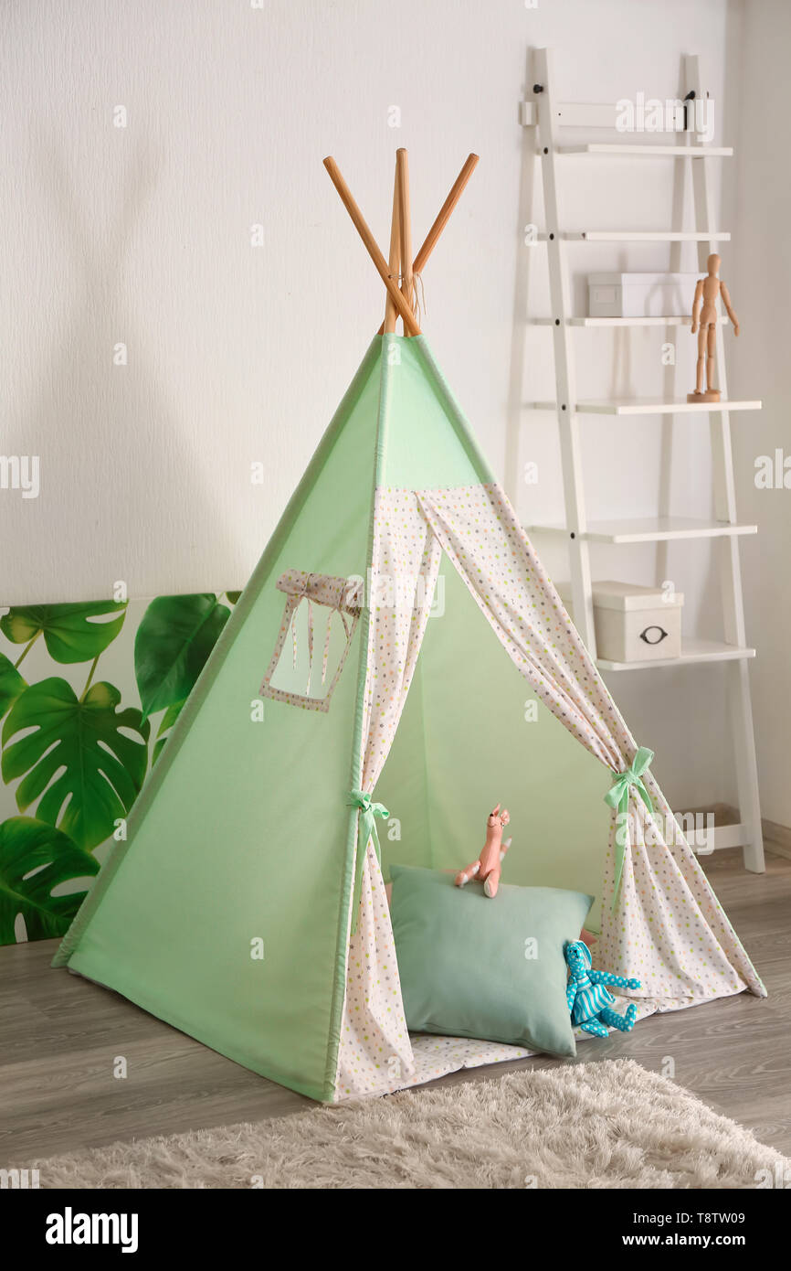 Cozy play tent for kids in room Stock Photo Alamy