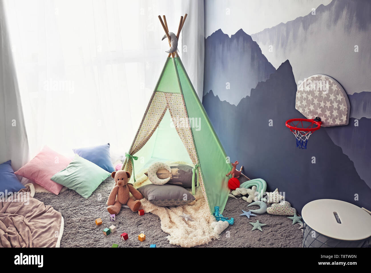 Cozy play tent for kids in child room Stock Photo