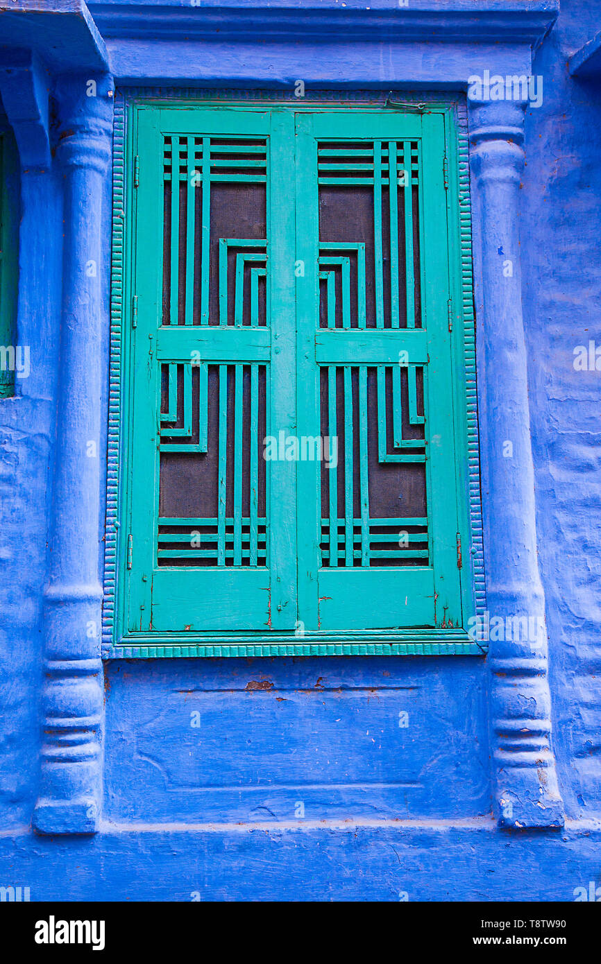 Old vintage green window against blue wall, jodhpur background Image
