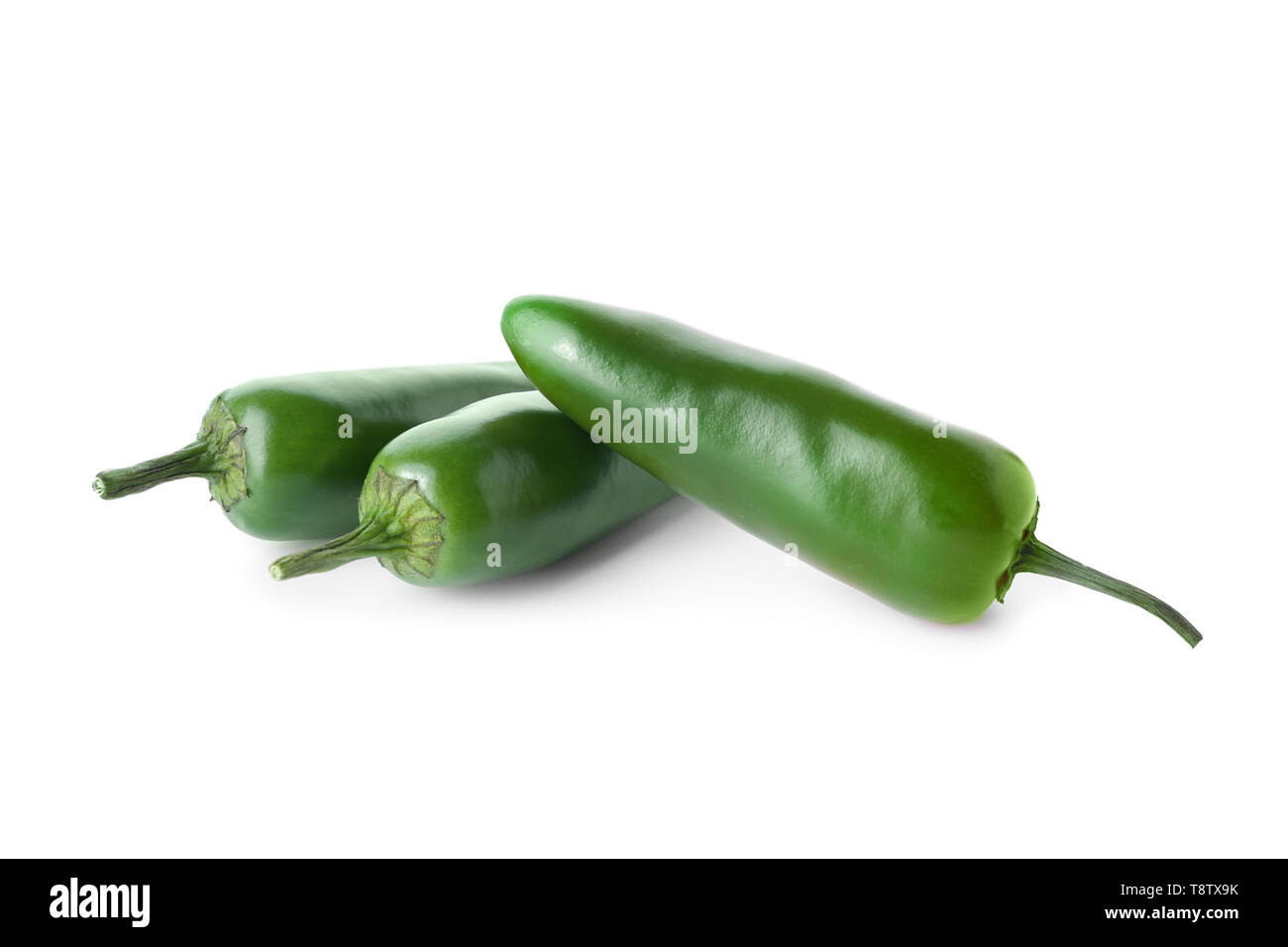 Fresh green peppers on white background Stock Photo - Alamy