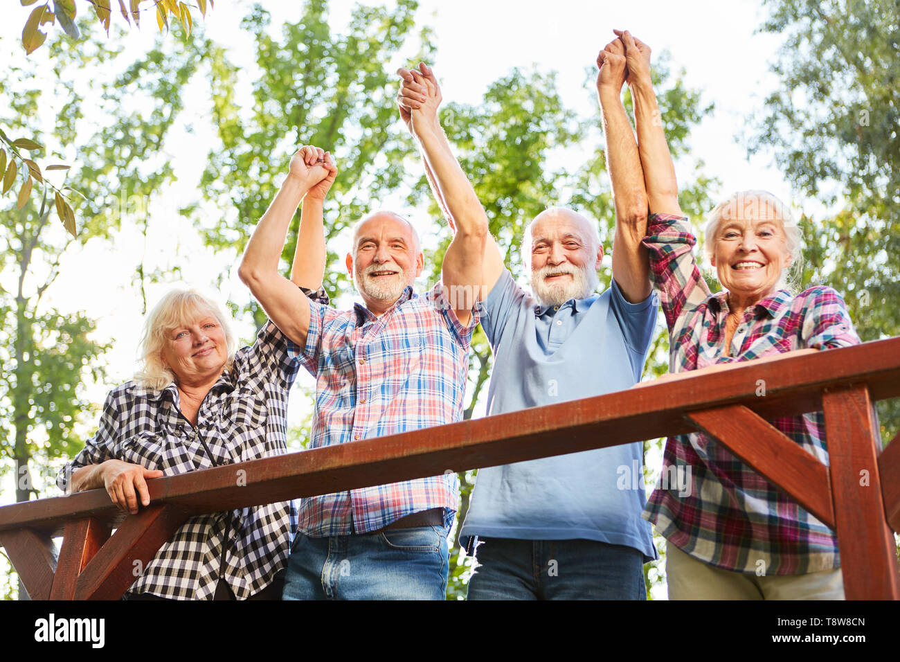 Group of seniors cheers together on a summer vacation excursion Stock Photo