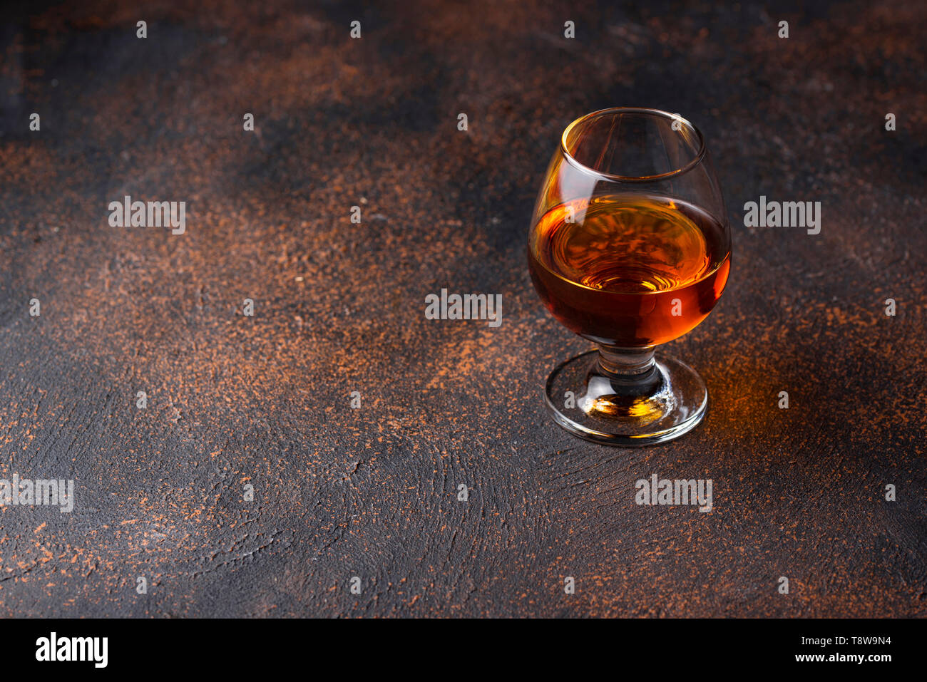 Glass of cognac or whiskey Stock Photo Alamy