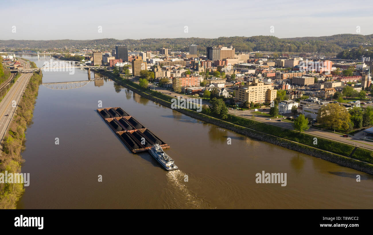 Charleston West Virginia is an active seaport here a barge moves coal
