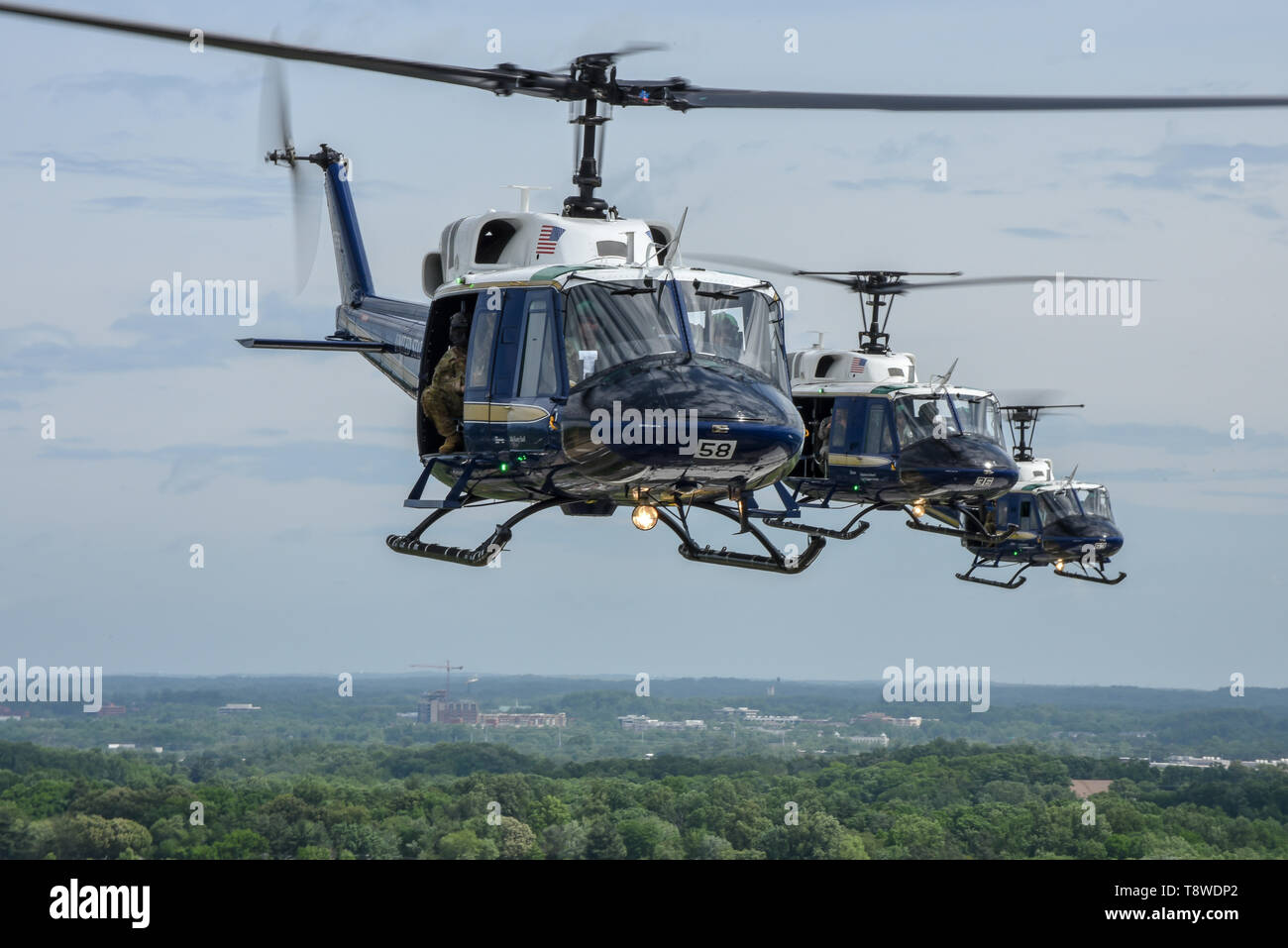 members-of-the-1st-helicopter-squadron-fly-uh-1-hueys-over-washington-during-opening-ceremonies-of-the-joint-base-andrews-air-space-expo-may-10-us-air-force-photo-by-2nd-lt-jessica-cicchetto-T8WDP2.jpg