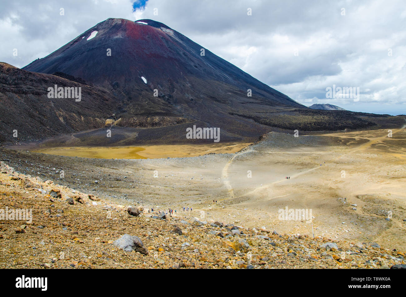 View of Mount Ngauruhoe - Mount Doom from Tongariro Alpine Crossing hike with clouds above. Stock Photo