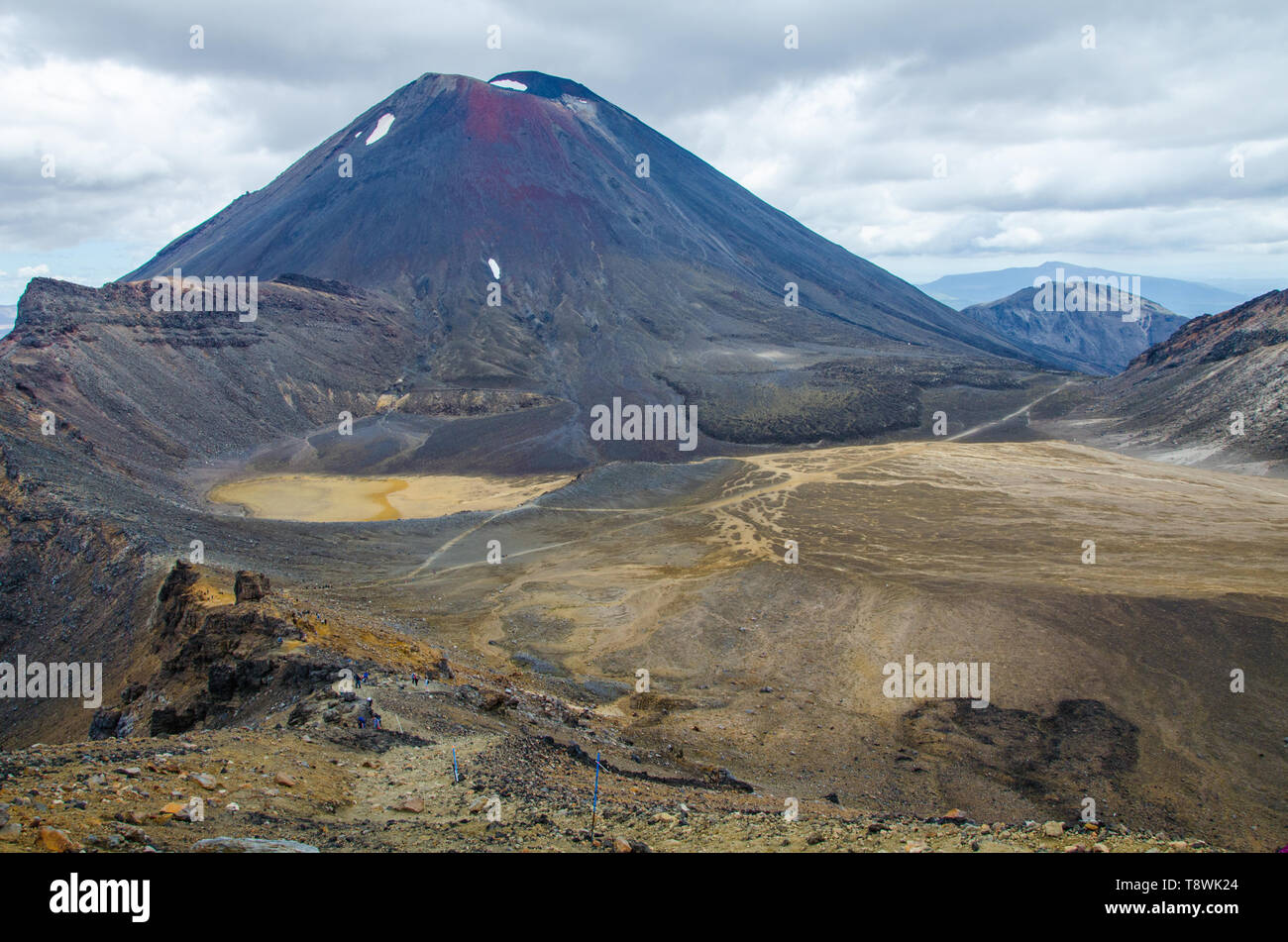 View of Mount Ngauruhoe - Mount Doom from Tongariro Alpine Crossing hike with clouds above. Stock Photo