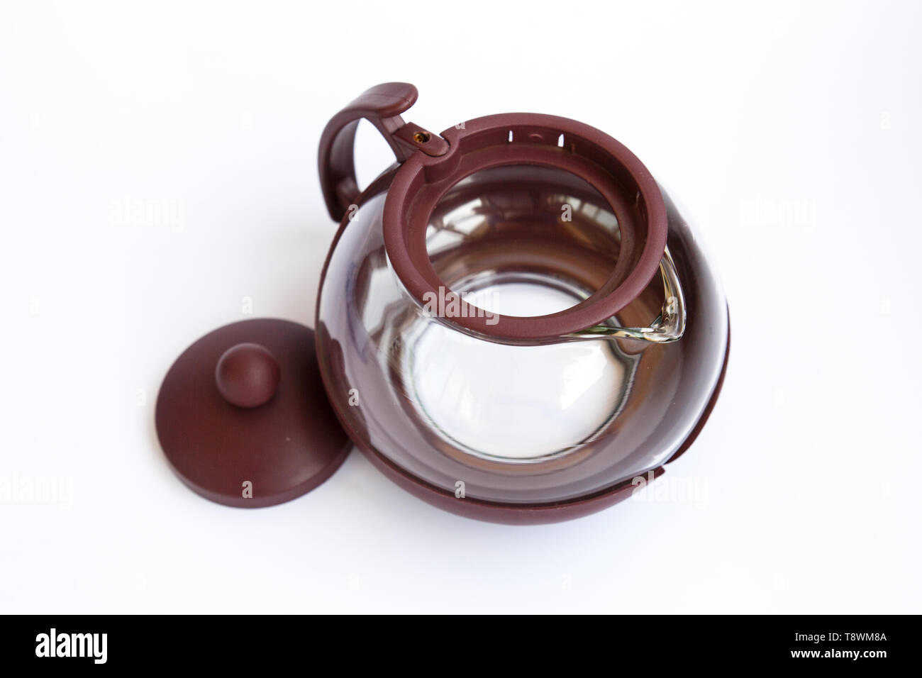 Empty glass teapot on white background Stock Photo