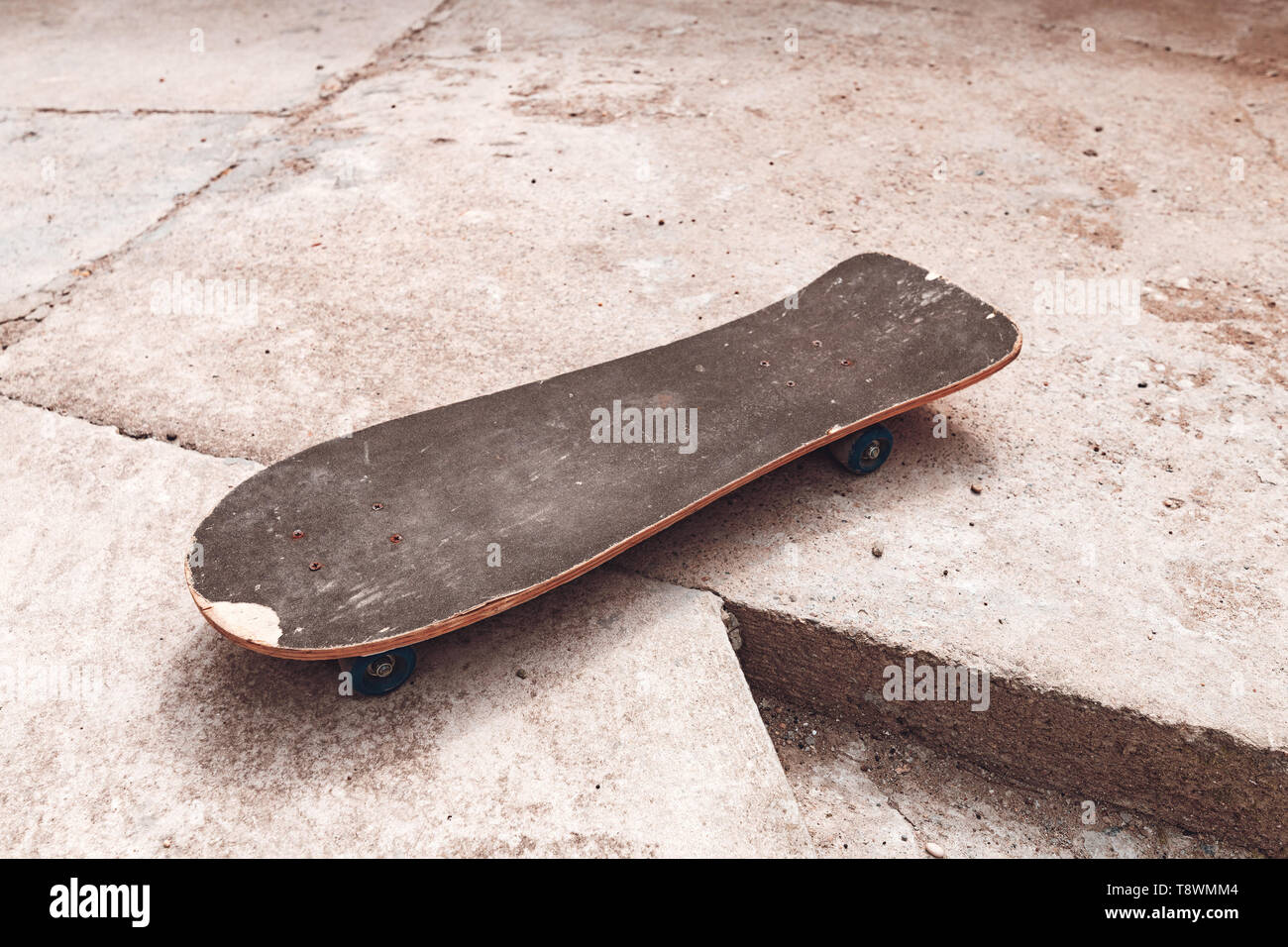 Old worn skateboard sports equipment with copy space Stock Photo