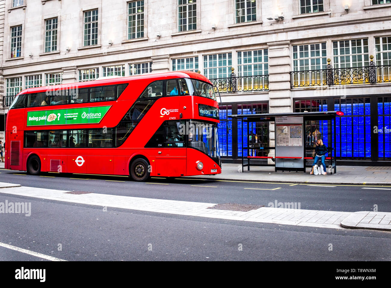 red double decker bus in Oxford Street, London Stock Photo