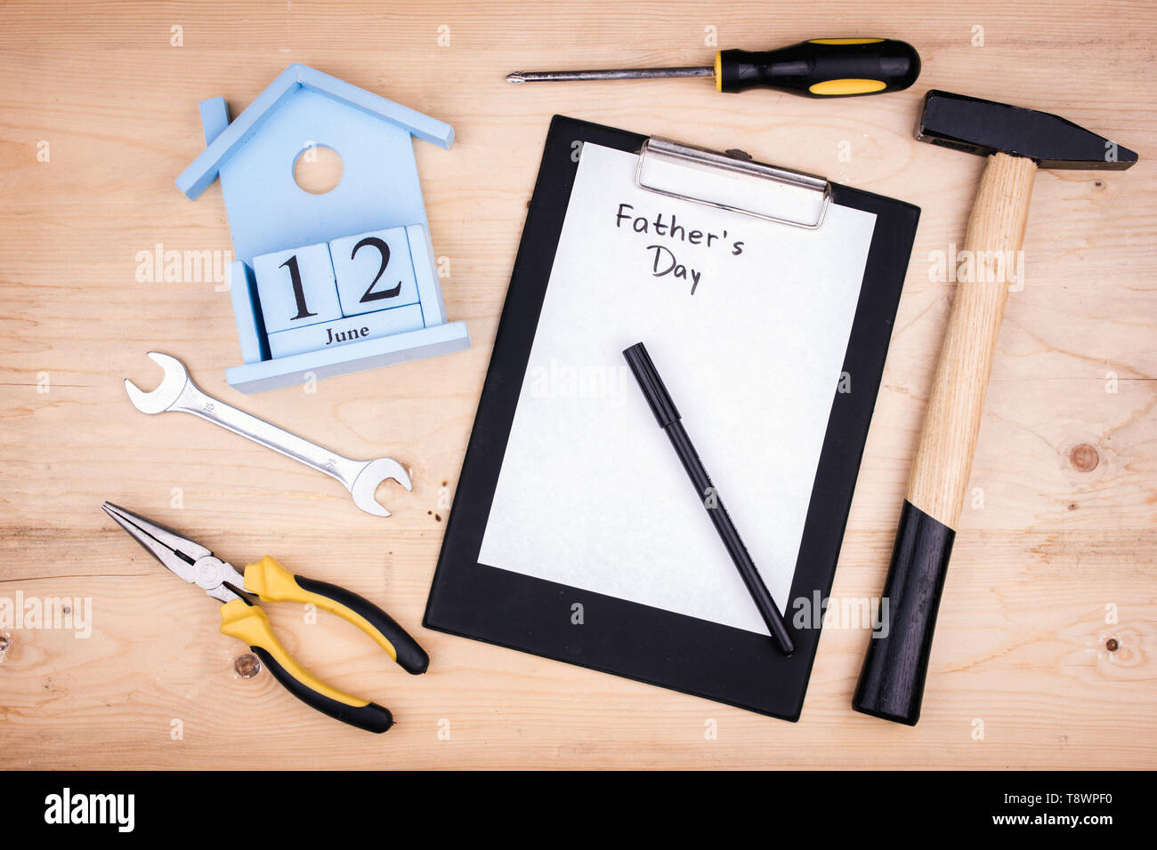 Repair tools - hammer, screwdrivers, adjustable wrenches, pliers. Sheet of  a white paper. Male concept for father's day 12 of June Stock Photo - Alamy