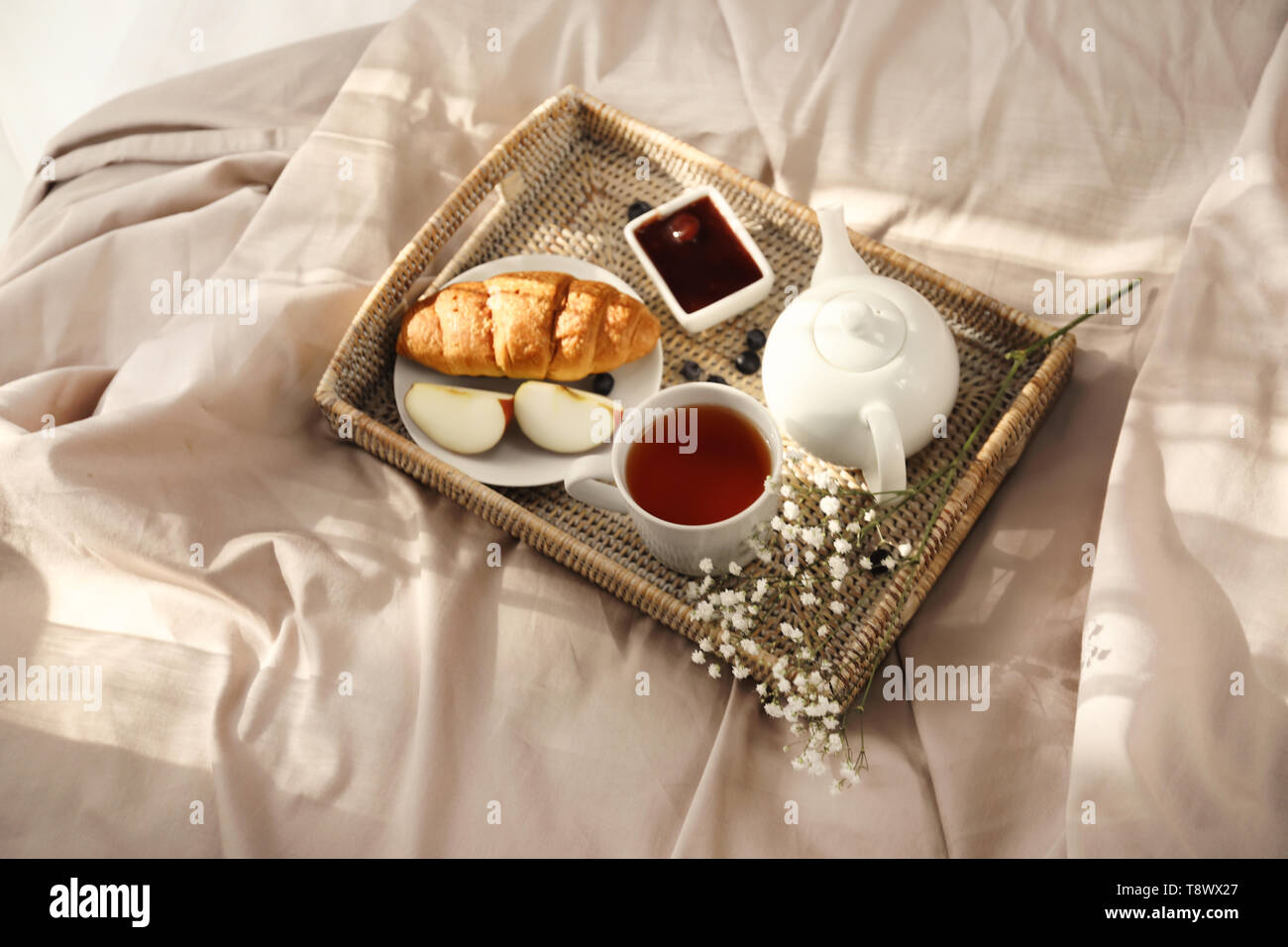 Wicker Tray With Delicious Breakfast On Bed Stock Photo Alamy