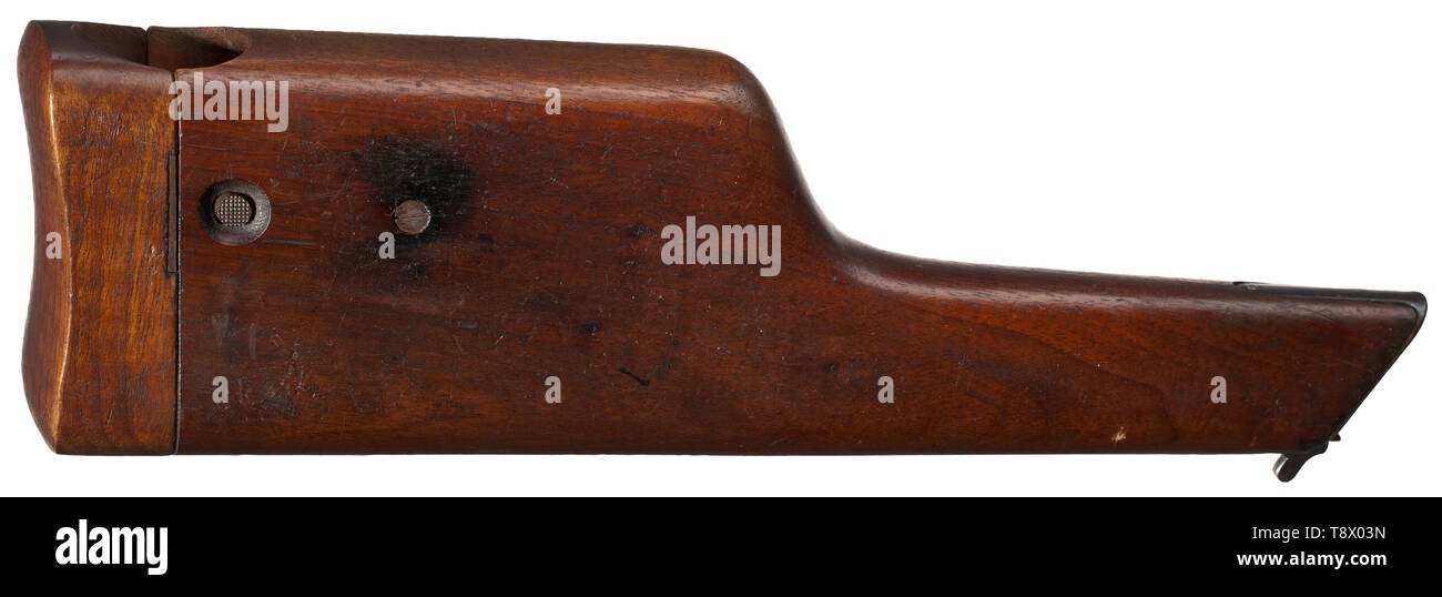 A Mauser C 96 'Prewar Commercial', England contract (?) Cal. 7.63 mm, no. 99671. Matching numbers. Bright bore. Proof-marked double crown/U. 1912 manufacture. Contract no. 706. Tangent rear sight scaled 50 - 1000. Three-line corporate name on barrel root, two-lines on frame. Complete original finish, minimally spotted at grip, stock marks. Small and operational parts yellow and blue. Hammer and hammer housing etched grey. Black hard rubber grip panels with logo, typically for export. Original lanyard loop. Almost as new condition. Comes with a da, Additional-Rights-Clearance-Info-Not-Available Stock Photo