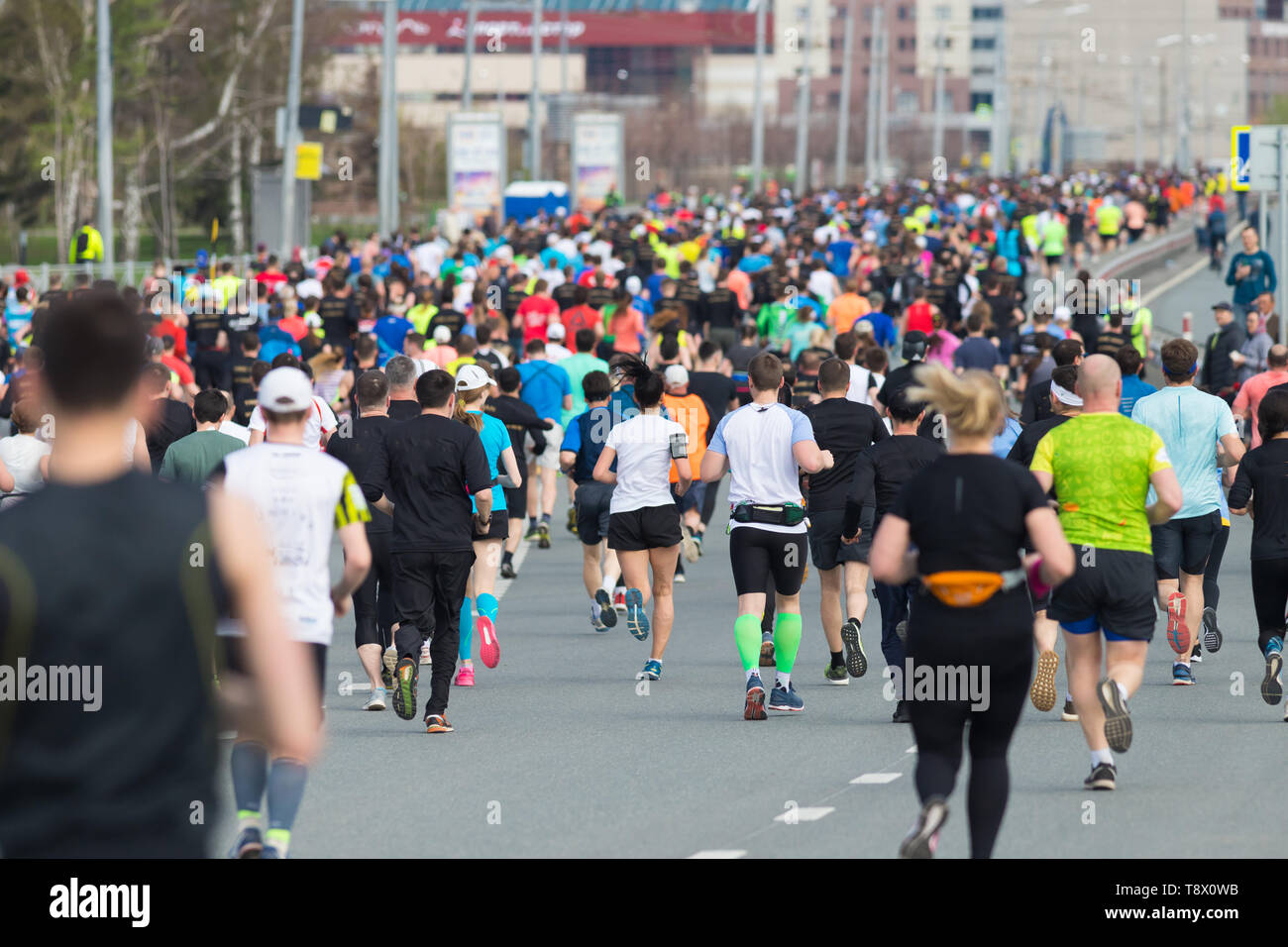 Marathon Running In The City In Daylight View From The Back Stock Marathon Running In The City In Daylight View From The Back Stock