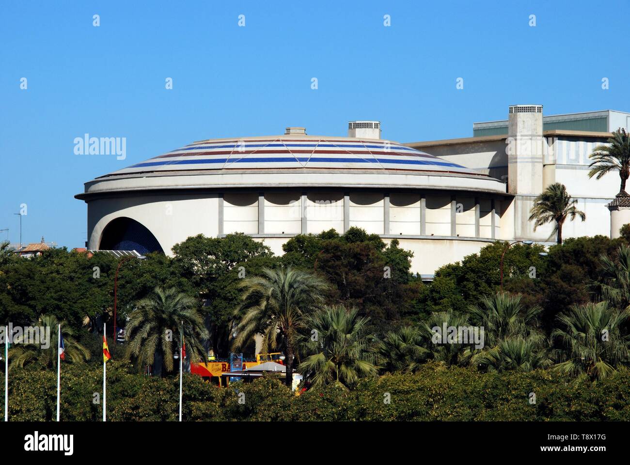 View of the Maestranza theatre with trees in the foreground, Seville, Seville Province, Andalusia, Spain, Europe. Stock Photo