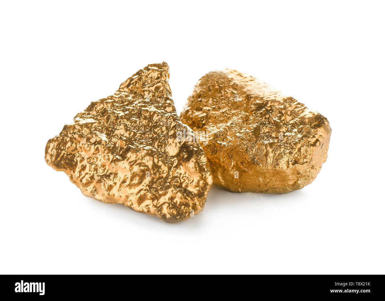 Gold nuggets on white background Stock Photo - Alamy