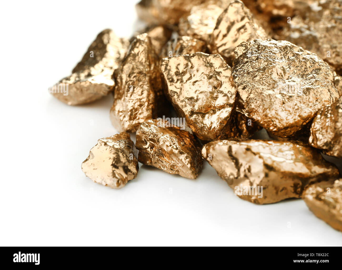 Gold nuggets on white background Stock Photo - Alamy