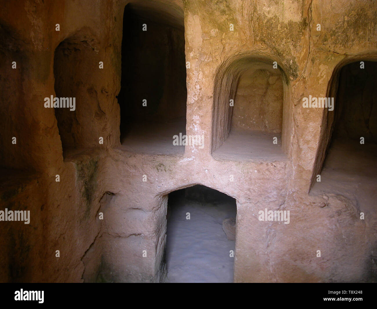 inside the sunken courtyard of a burial chamber, Tombs of the Kings ...