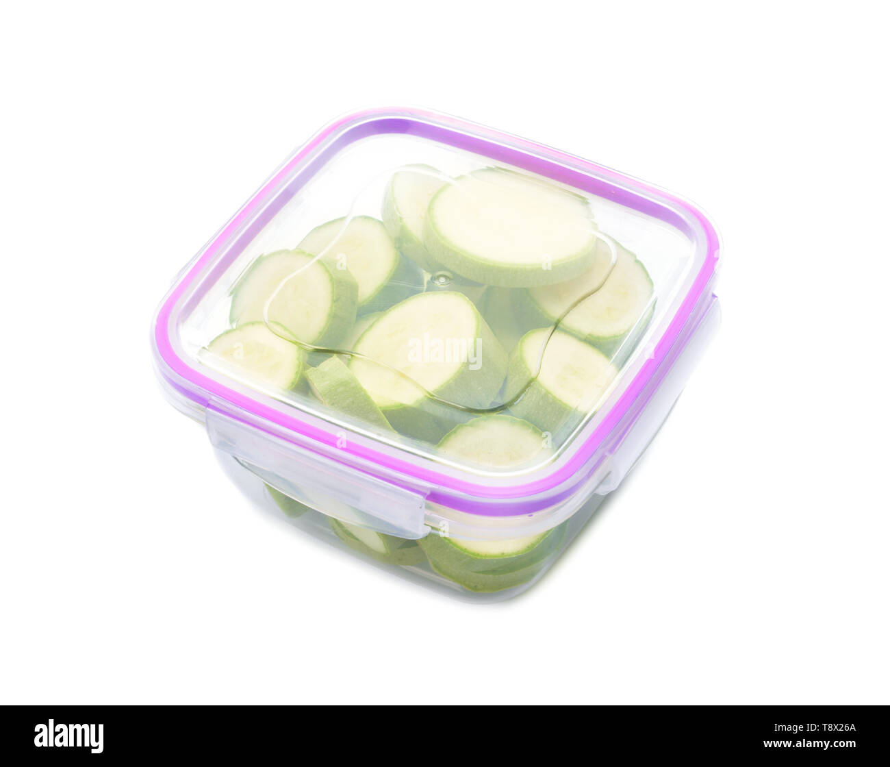 Plastic container with fresh squash for freezing on white background