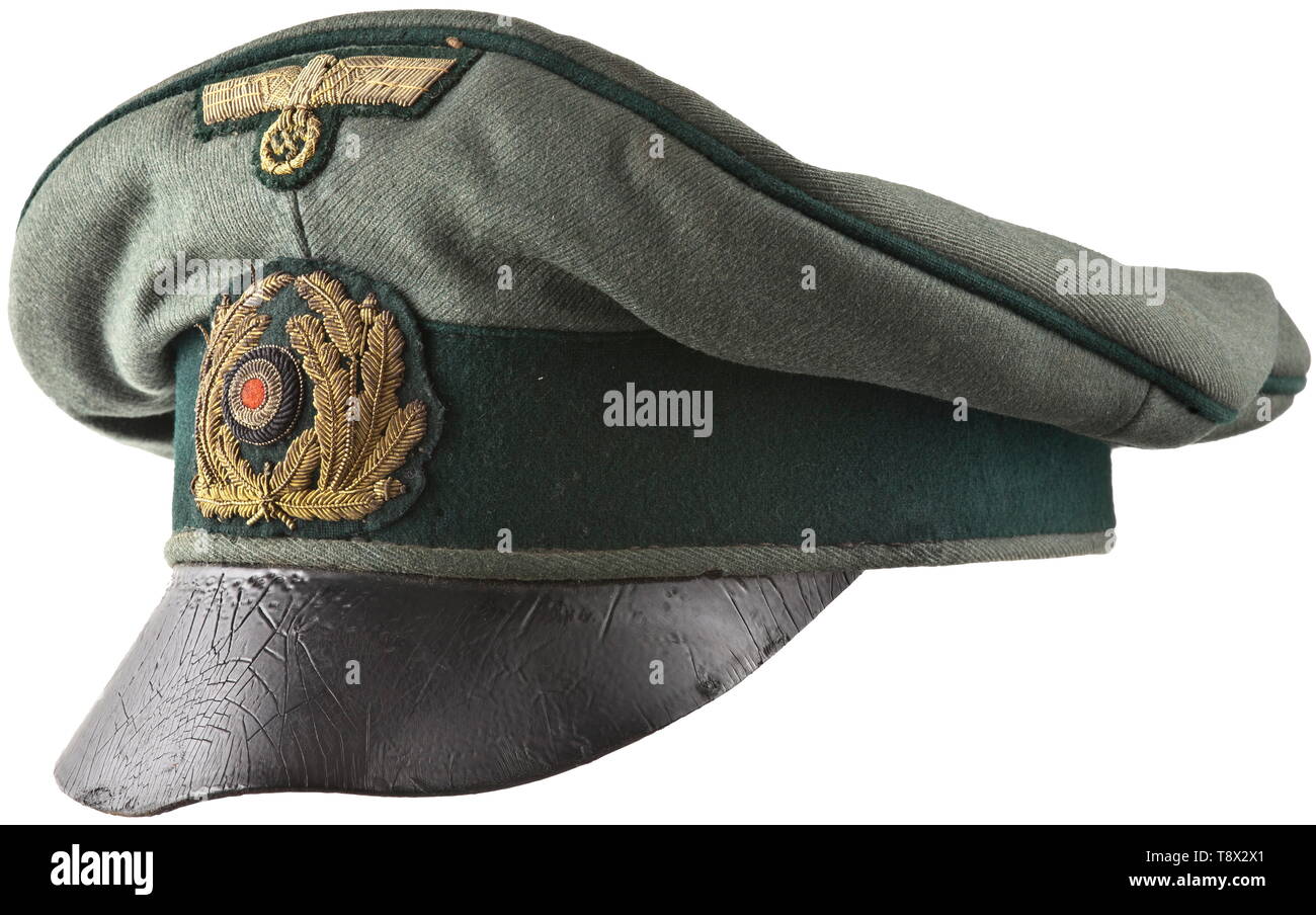 An old style field cap for officers of coastal artillery Cap body of field-grey cloth, dark-green trim band and piping, navy-blue inner liner (damaged cap trapezoid with name tag 'Kißing'), dark-brown leather sweatband, the visor of soft, black lacquered leather. Hand-embroidered cap insignia in gilt tinsel thread. A heavily used cap with signs of age and moth traces. historic, historical, navy, naval forces, military, militaria, branch of service, branches of service, armed forces, armed service, object, objects, stills, clipping, clippings, cut out, cut-out, cut-outs, 20t, Editorial-Use-Only Stock Photo