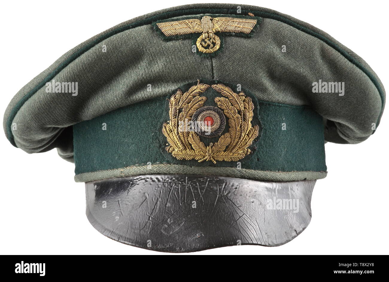An old style field cap for officers of coastal artillery Cap body of field-grey cloth, dark-green trim band and piping, navy-blue inner liner (damaged cap trapezoid with name tag 'Kißing'), dark-brown leather sweatband, the visor of soft, black lacquered leather. Hand-embroidered cap insignia in gilt tinsel thread. A heavily used cap with signs of age and moth traces. historic, historical, navy, naval forces, military, militaria, branch of service, branches of service, armed forces, armed service, object, objects, stills, clipping, clippings, cut out, cut-out, cut-outs, 20t, Editorial-Use-Only Stock Photo