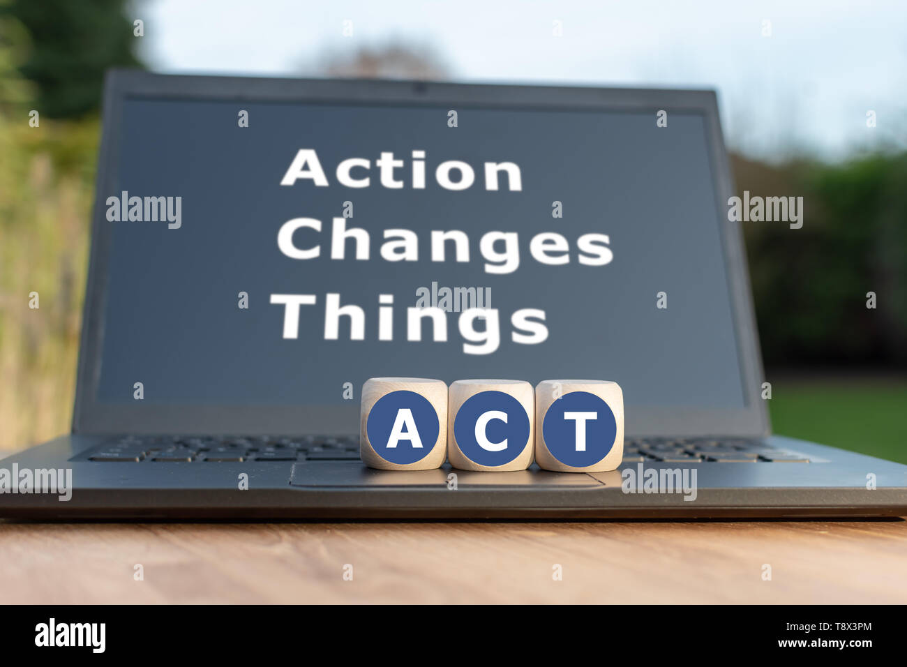 Dice form the abbreviation "ACT". Dice placed on a Notebook. The text  "Action changes things" is written on the display Stock Photo - Alamy