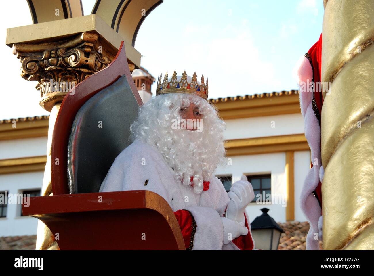 Three Kings Parade with Melchor sitting in his carriage, La Cala de Mijas, Costa del Sol, Malaga Province, Spain. Stock Photo