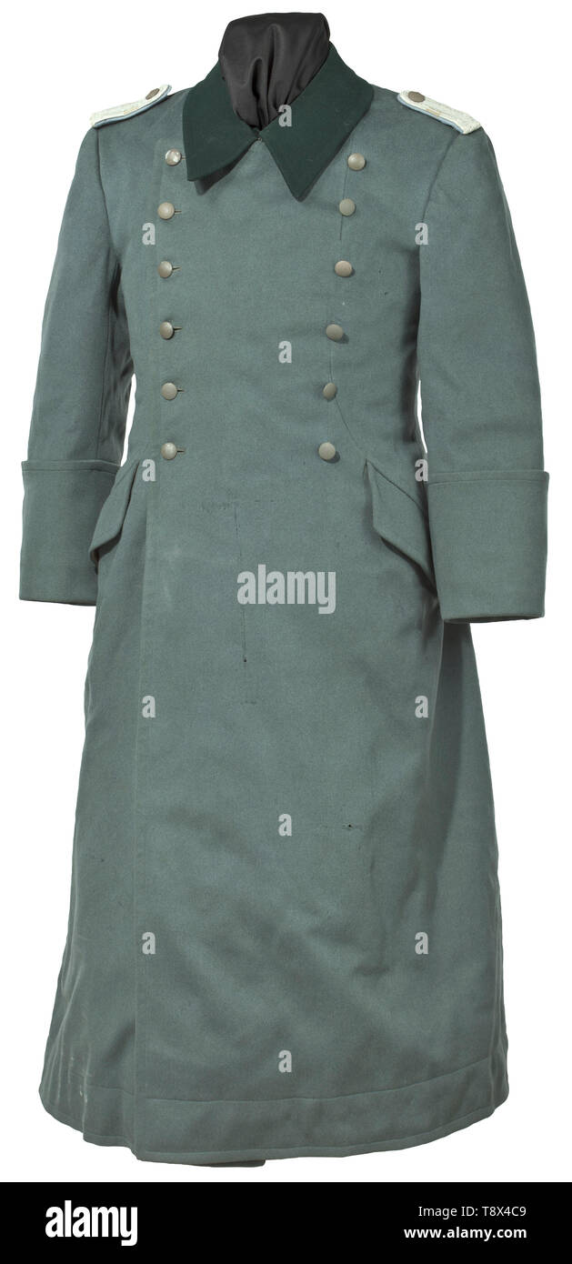 A winter coat for a Leutnant of motor transport troops Private purchase piece in fine field-grey cloth with dark green collars, field-grey buttons and sewn-on shoulder boards. Moth traces. At that time a very expensive and high-quality tailor's production, complete with black-brown fur lining. historic, historical, army, armies, armed forces, military, militaria, object, objects, stills, clipping, clippings, cut out, cut-out, cut-outs, 20th century, Editorial-Use-Only Stock Photo
