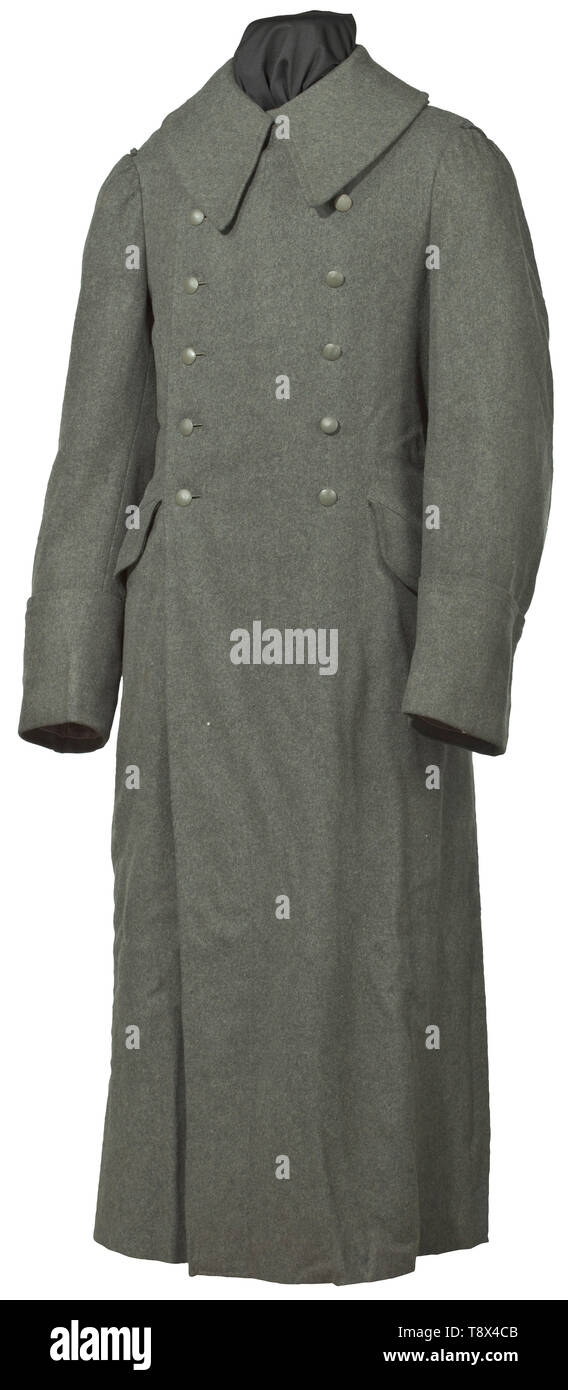 An overcoat for army personnel depot piece from the year 1942 Issue with large collar in field-grey woollen cloth, field-grey buttons, depot- and size stamps from 1942 in brownish cotton liner. historic, historical, army, armies, armed forces, military, militaria, object, objects, stills, clipping, clippings, cut out, cut-out, cut-outs, 20th century, Editorial-Use-Only Stock Photo