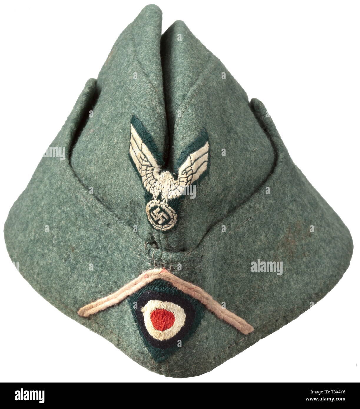 A garrison cap M 38 'Schiffchen' for enlisted men/NCOs of panzer troops Depot piece of field-grey woollen cloth, field-grey painted fine zinc ventilation rivets, brownish inner liner with faded maker's stamping, BeVo weave insignia on a dark green ground, pink soutache chevron. Light signs of usage and age. historic, historical, army, armies, armed forces, military, militaria, object, objects, stills, clipping, clippings, cut out, cut-out, cut-outs, 20th century, Editorial-Use-Only Stock Photo