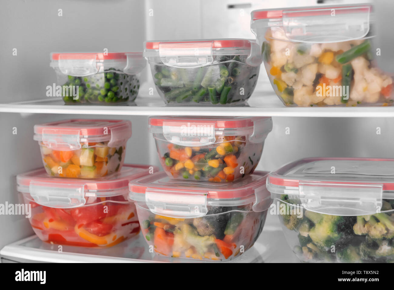 https://c8.alamy.com/comp/T8X5N2/containers-with-frozen-vegetables-in-refrigerator-T8X5N2.jpg