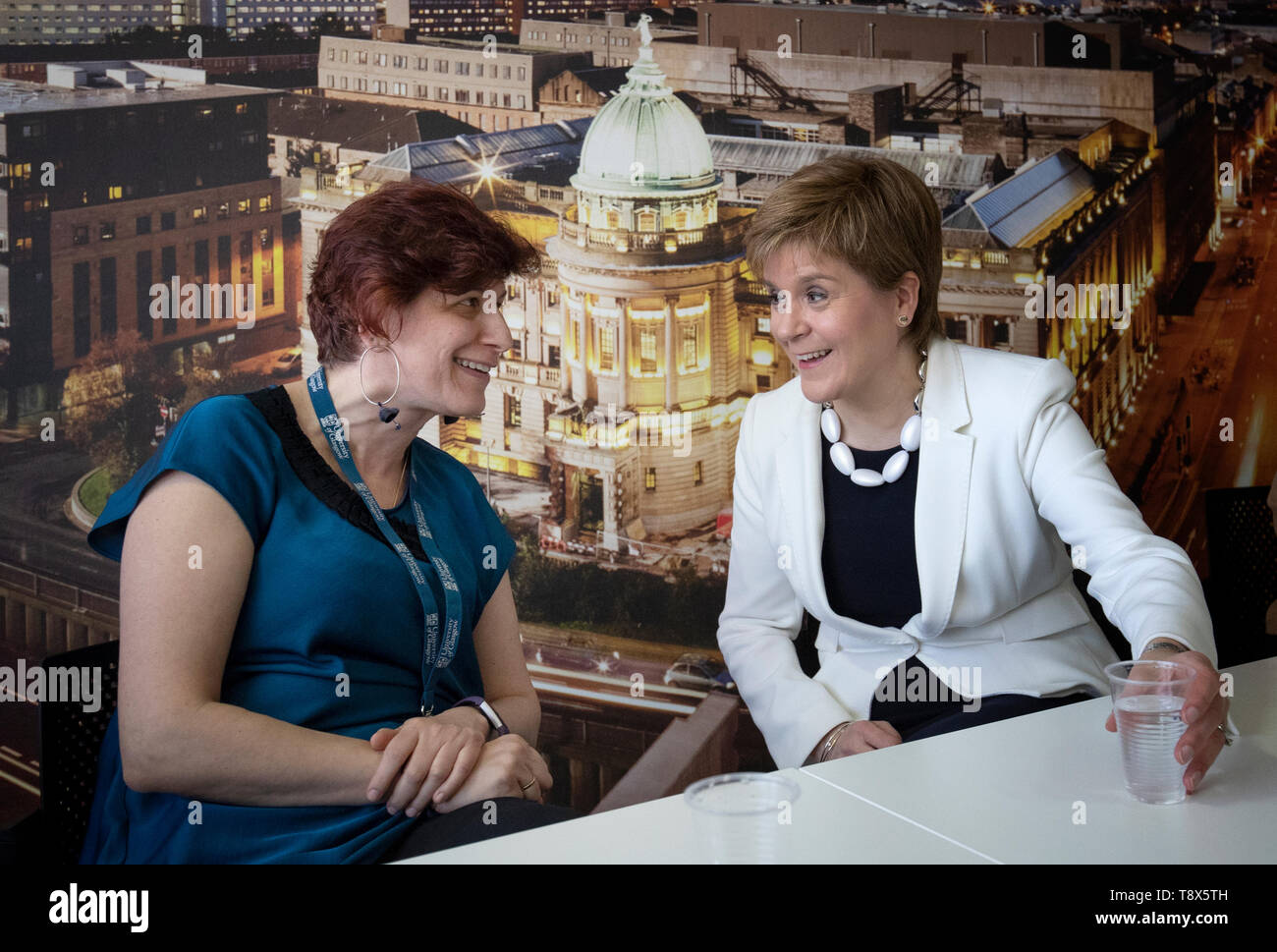 First Minister Nicola Sturgeon (right) with senior lecturer Maria Economou from Greece during a visit to Tay House, Glasgow, where she met with EU nationals working at the University of Glasgow ahead of next week's European election. Stock Photo