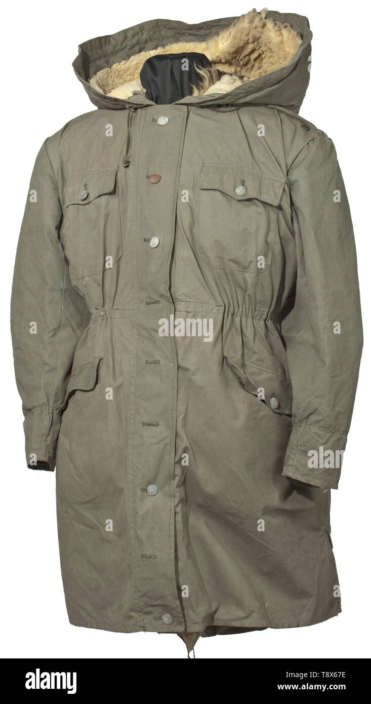 A winter parka of the Waffen-SS produced ca. 1942, the so-called "Kharkov  Parka" Long issue in field-grey, water-repellent fabric with continuous,  coverable button fly, two superimposed breast- and two applied hip pockets,