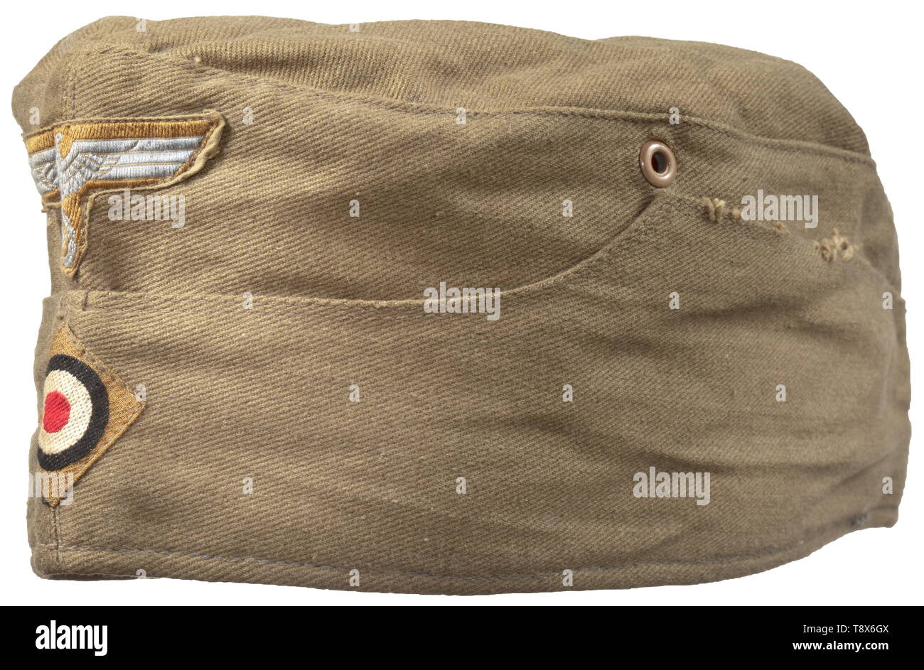 A side cap for enlisted men/NCOs of the army tropical issue of the German Africa Korps Depot piece in olive-coloured linen, brown painted zinc ventilation rivets, red inner liner with depot-, size- and maker's stampings ('56 Hans Branal Mützenfabrik Magdeburg-N. Ritterstraße 12-13 842'), BeVo weave insignia in tropical issue on a sand-coloured ground. historic, historical, 20th century, Additional-Rights-Clearance-Info-Not-Available Stock Photo