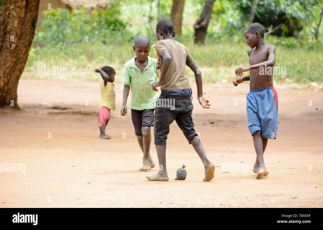 3 Malawian Boys Play Football With A Home Made Ball Constructed Out Of Plastic Bags Bound By Rubber Ties From A Recycled Tyre Stock Photo Alamy