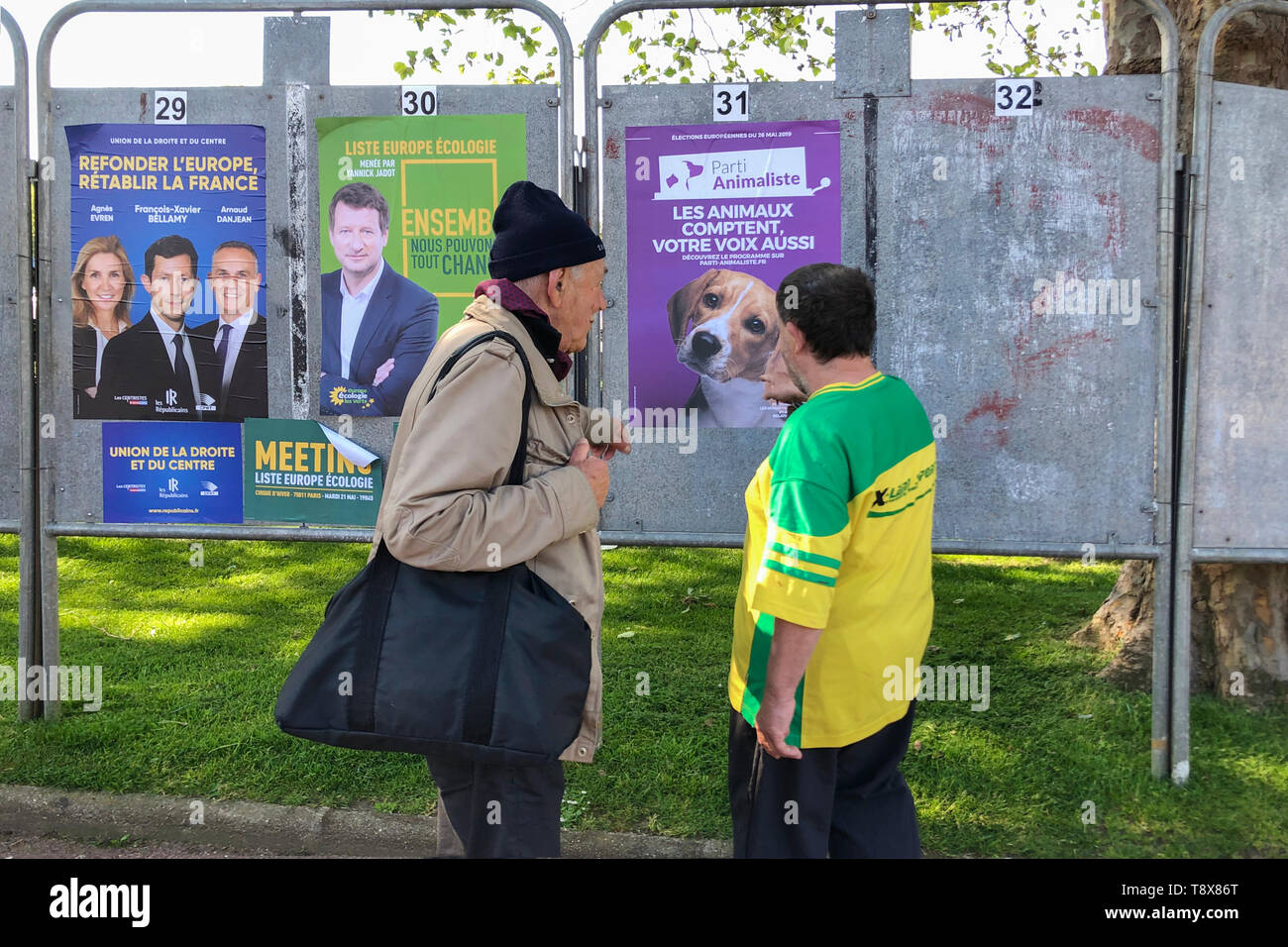 DIEPPE, FRANCE - MAY 15, 2019 : Men look at the banner with candidates for elections to the European Union Stock Photo