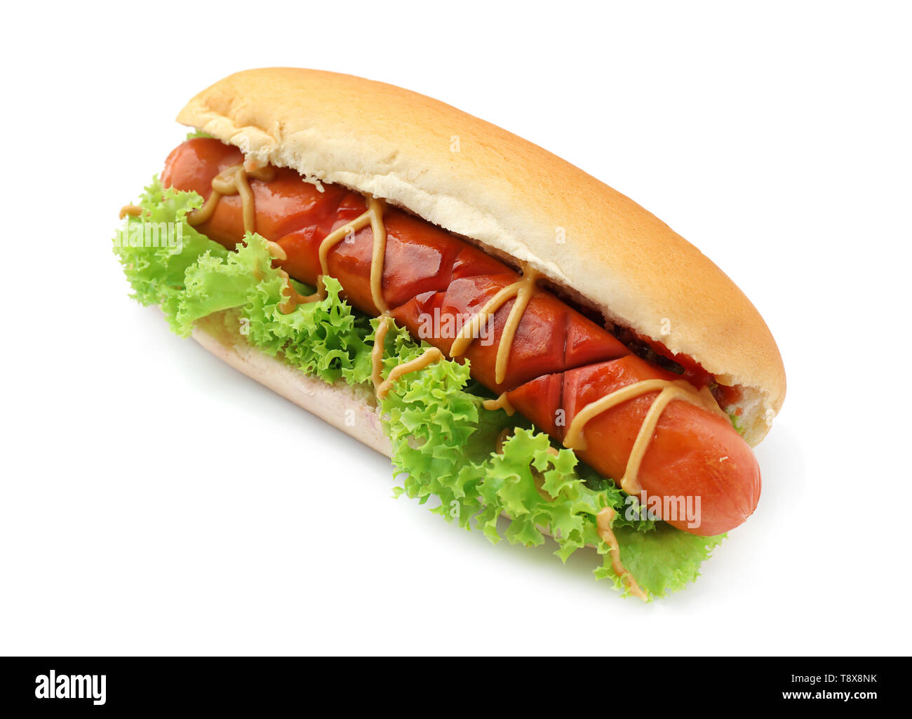 Tasty hot dog with lettuce and sauces on white background Stock Photo