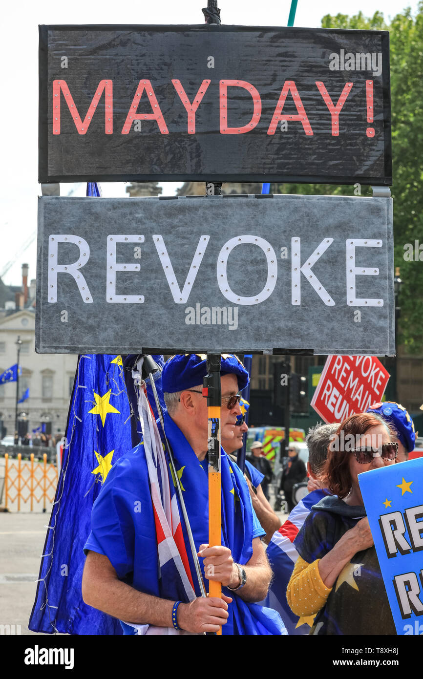 Westminster, London, UK. 15th May, 2019. A remain protester with 'Mayday' sign. Pro and Anti Brexit protesters demonstrate around the Houses of Parliament in Westminster today. Credit: Imageplotter/Alamy Live News Stock Photo