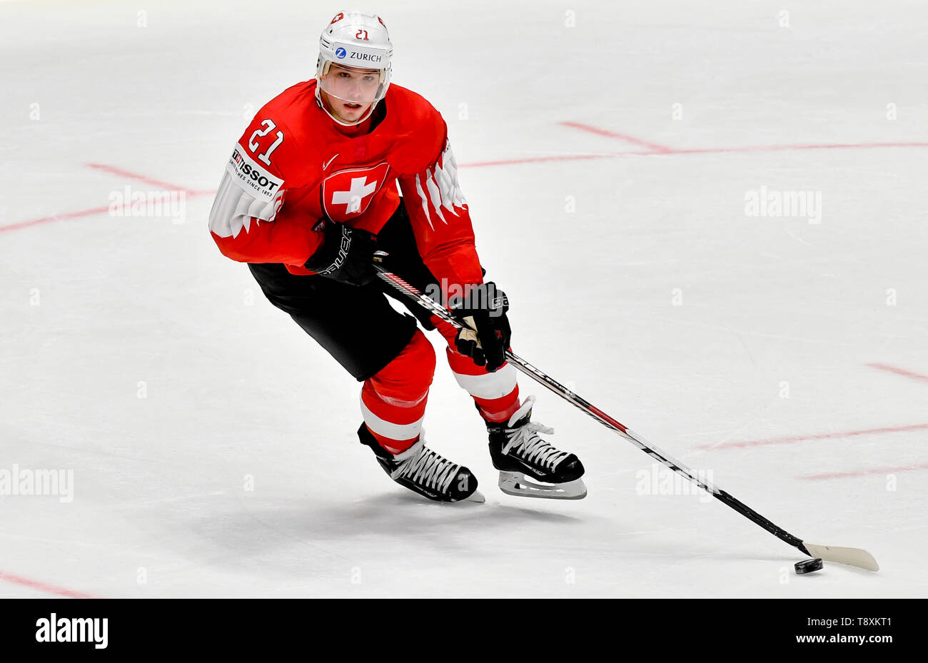 Nico Hischier of Switzerland, left, fights for a puck with goalie Samuel  Montembeault of Canada during the group B match between Switzerland and  Canada at the ice hockey world championship in Riga