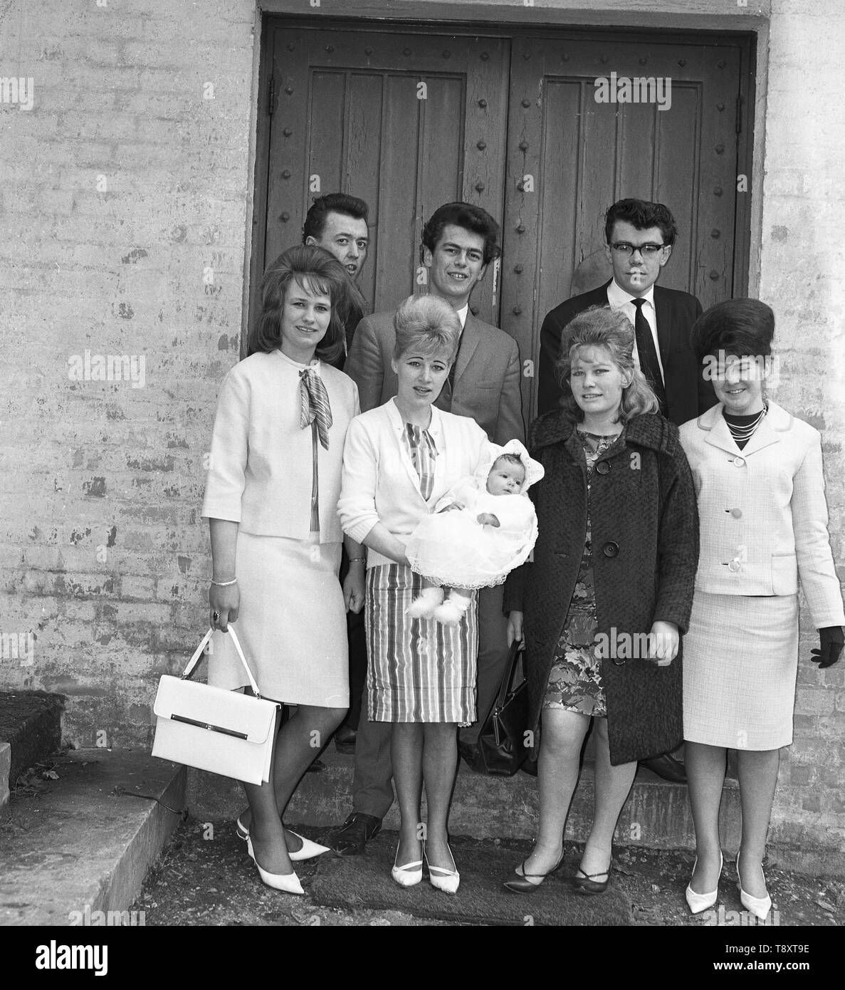 A Baby Christening in the UK c1962  Group shot of baby with parents and possibly with god parents  Photo by Tony Henshaw Stock Photo