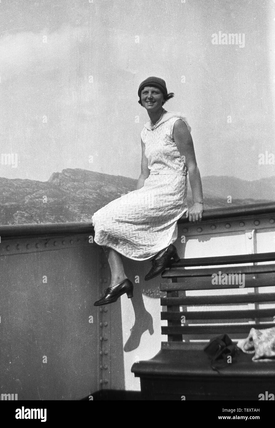 Woman posing in dress onboard a ship c1925  Photo by Tony Henshaw Stock Photo