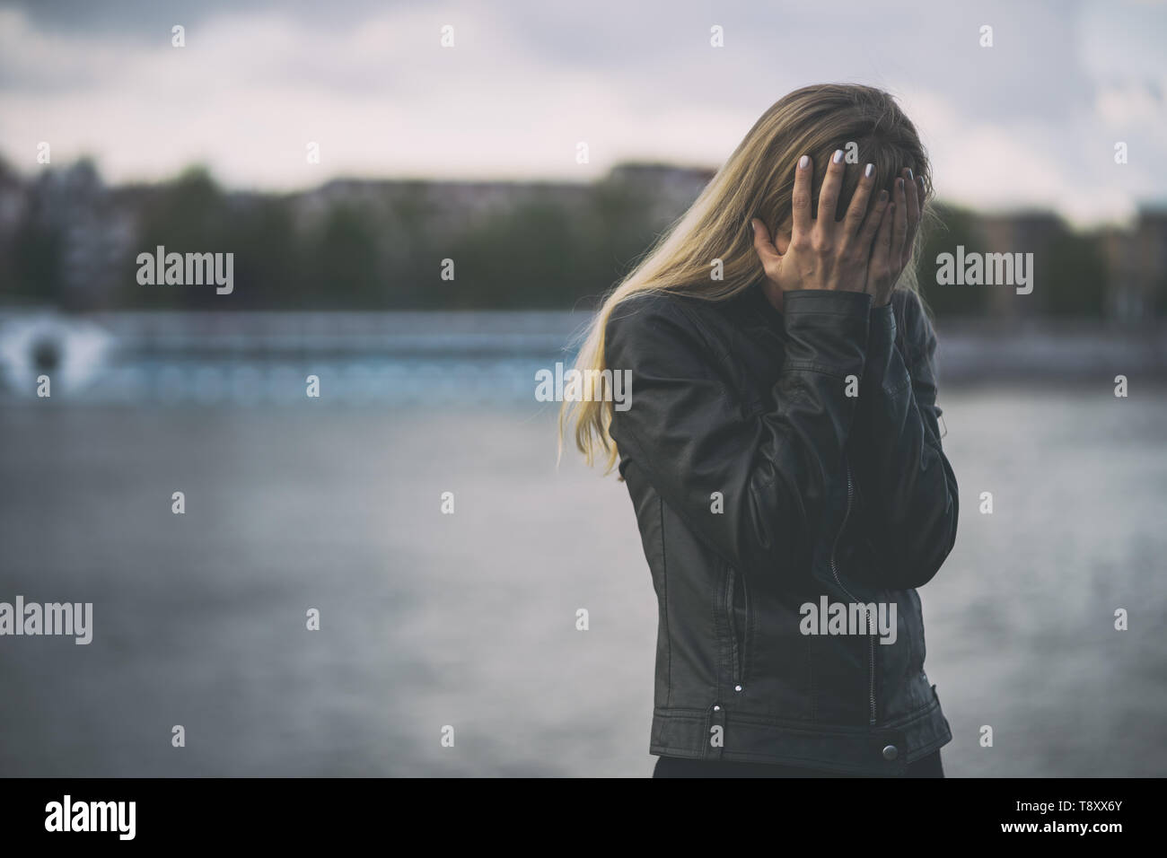 Portrait of lonely and depressed woman in grief. Stock Photo